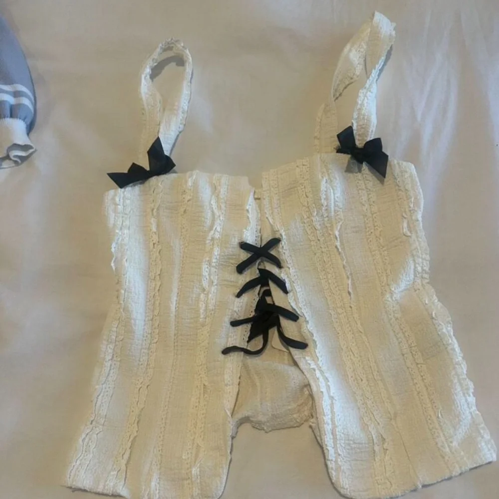 Textured Knit Bow Trim Lace Up Split Hem Top - Picture 2 of 2